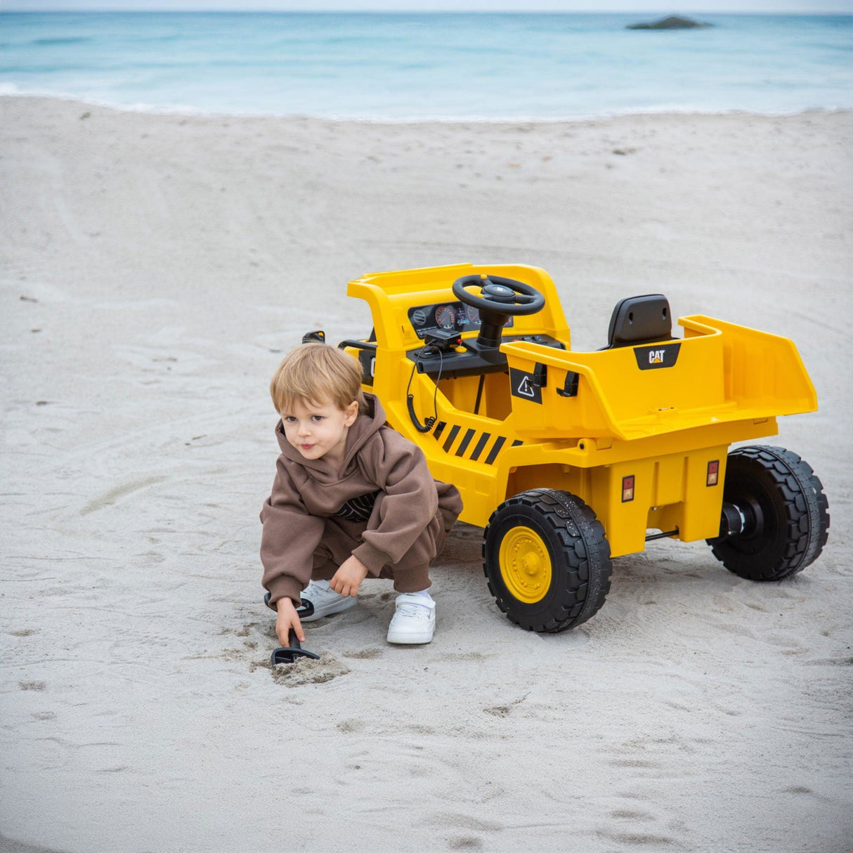 12V CAT Dump Truck Ride-On for Kids – Realistic Construction Adventure with Remote Control & Working Shovel | Ride On Kids