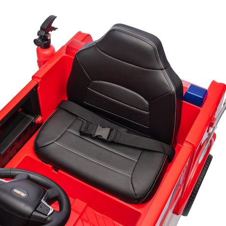 12V Kids Fire Truck Ride-On – Red children's electric car with emergency lights, megaphone, fire shovel, and sprinkler, designed for kids aged 3-8. View of the leather seat.