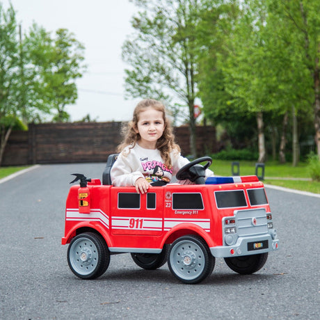 12V Kids Fire Truck Ride-On – Red children's electric car with emergency lights, megaphone, fire shovel, and sprinkler, designed for kids aged 3-8. Side view with kid playing.