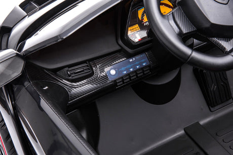24V Kids Car Lamborghini Veneno – A sleek, black children's electric car with two seats, EVA tires, and a realistic sports car design for kids aged 3-8 - view of the Bluetooth stereo system.