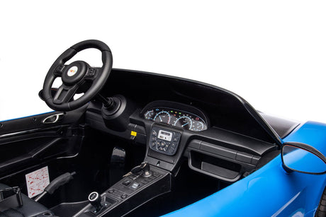 48V Turbo Racer Kids Electric Car – A high-speed, two-seater children's ride-on with a 600W motor, leather seats, LED lights, and all-terrain air tires - view of steering wheel and dashboard.